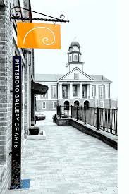 Image of Pittsboro Gallery of Arts in downtown Pittsboro facing the Chatham County Courthouse in the background.