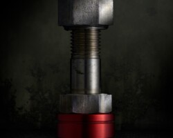 Still Life Bolt and Nut on Red Bushing Still Life Bolt and Nut on Red Bushing